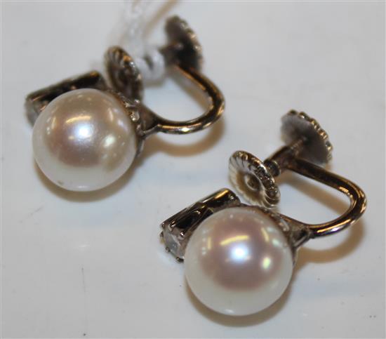 Pr of 14ct white gold, cultured pearl and diamond set ear clips.(-)
